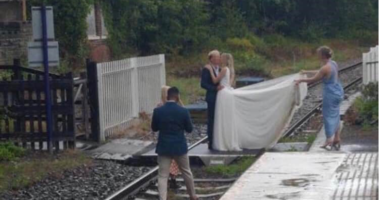 Couple having wedding photo on the tracks