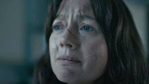 woman's face with breaking lines